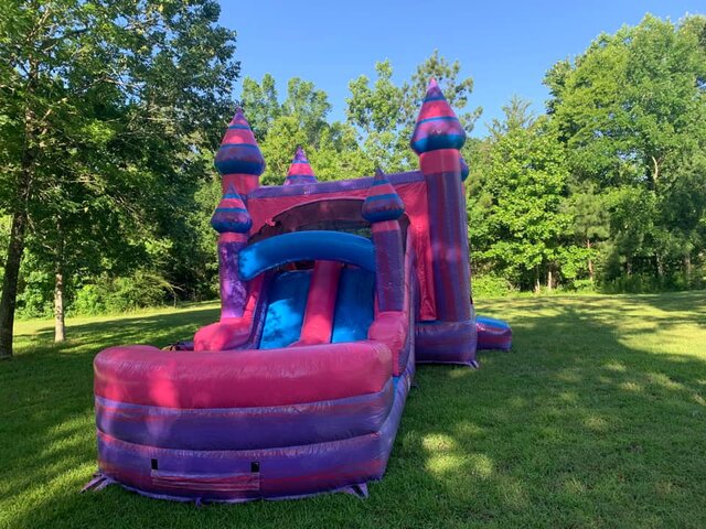 Pink and Purple Bounce house with slide side view