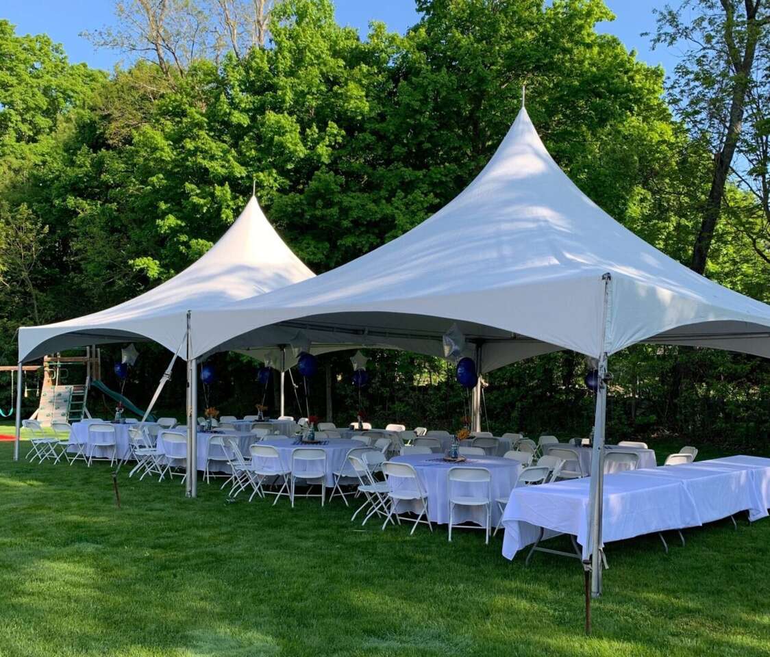 Tent, table, and chair setup by Hop A Lot Moonwalks for an outdoor event Tent, table, and chair setup by Hop A Lot Moonwalks for an outdoor event