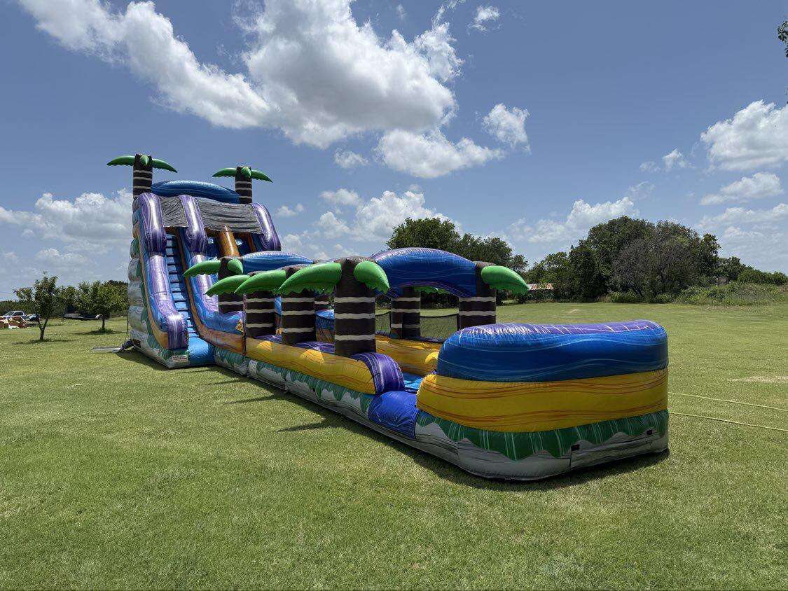 Water slide rentals from Hop A Lot Moonwalks Water slide rentals from Hop A Lot Moonwalks