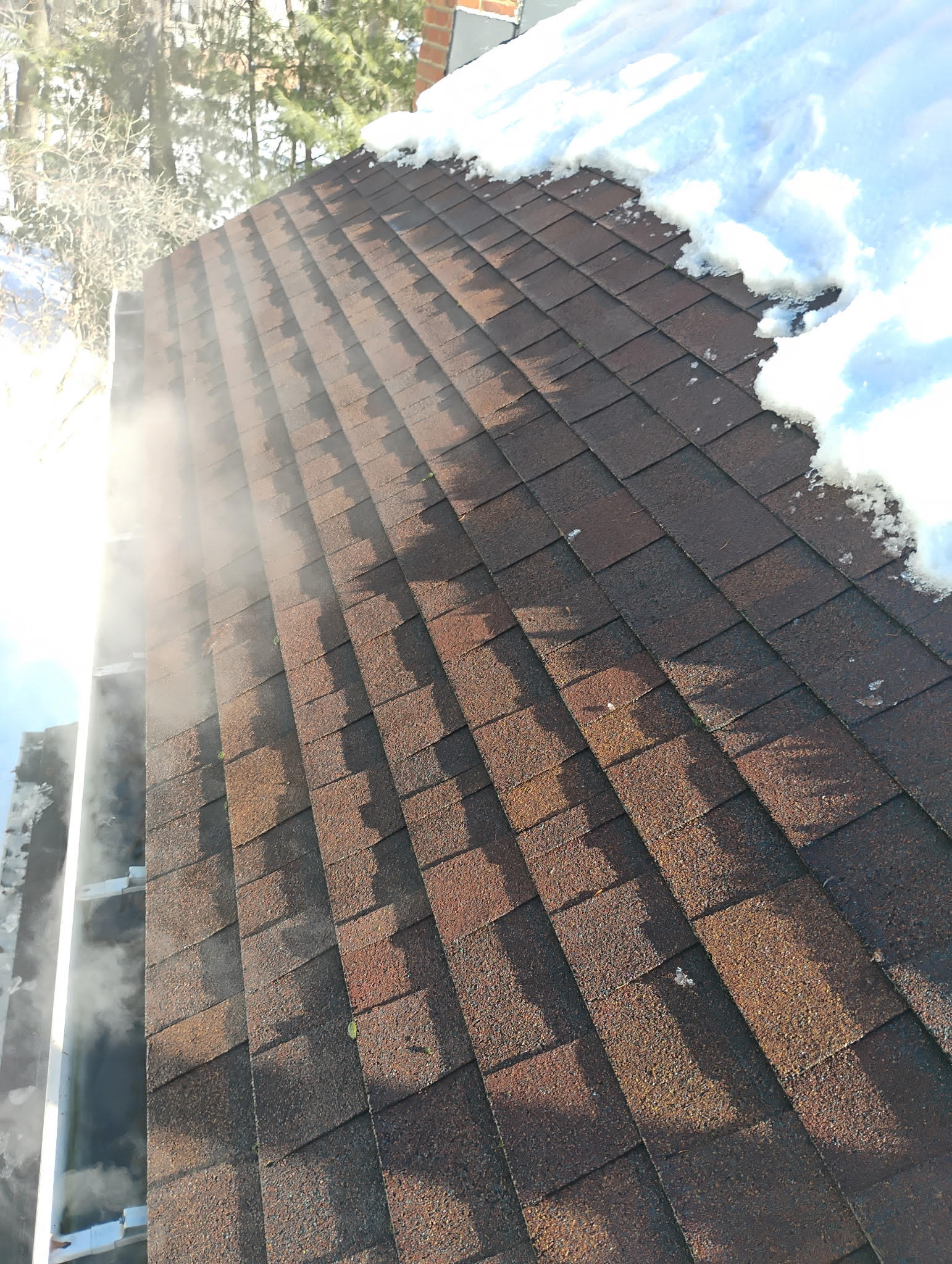 Cleared gutter system after professional steam ice removal