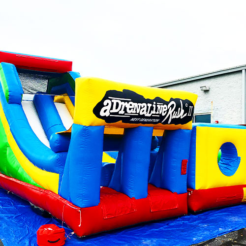 Kids enjoying an inflatable obstacle course at a party