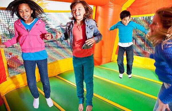 Kids jumping inside a bounce house rental in Oklahoma City