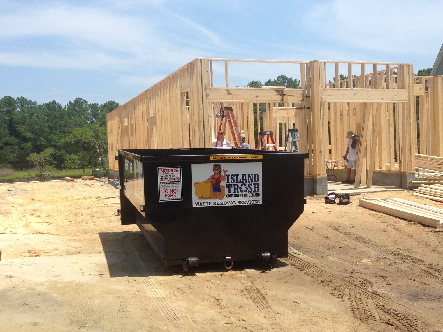 Roll-off dumpster at a construction site Roll-off dumpster at a construction site