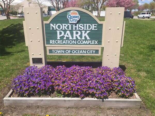 Sign for Northside Park Recreation Complex in Ocean City with flowers in front.
