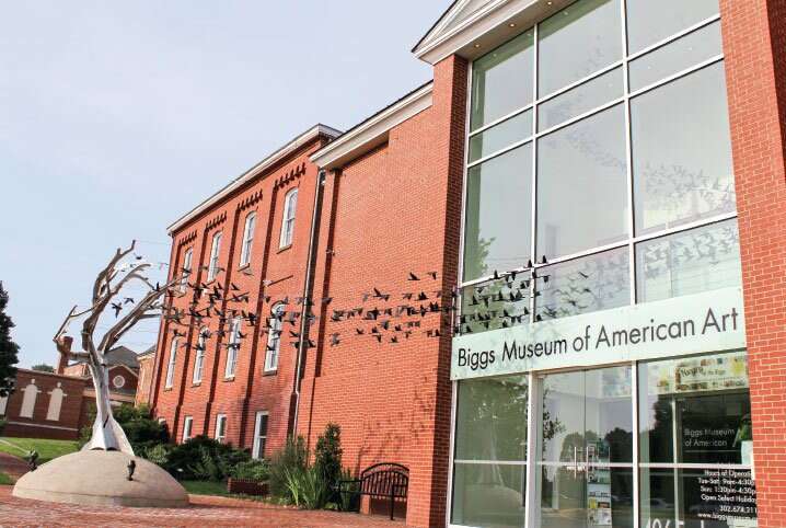 Exterior view of Biggs Museum of American Art with bird sculpture installation.