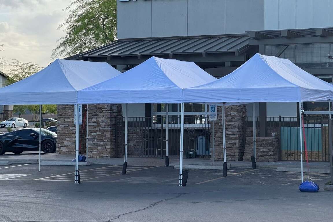 10x10 white canopy tent rental set up for outdoor dining and event space in Phoenix, Arizona