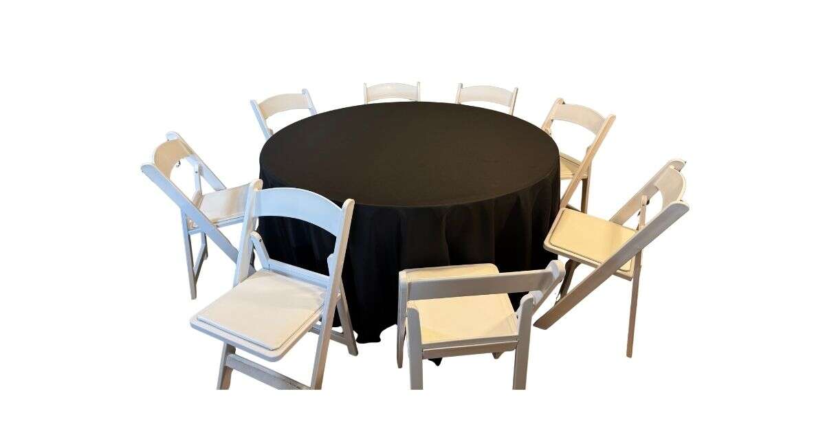 60 in round table with white resin chairs and black linen tablecloth