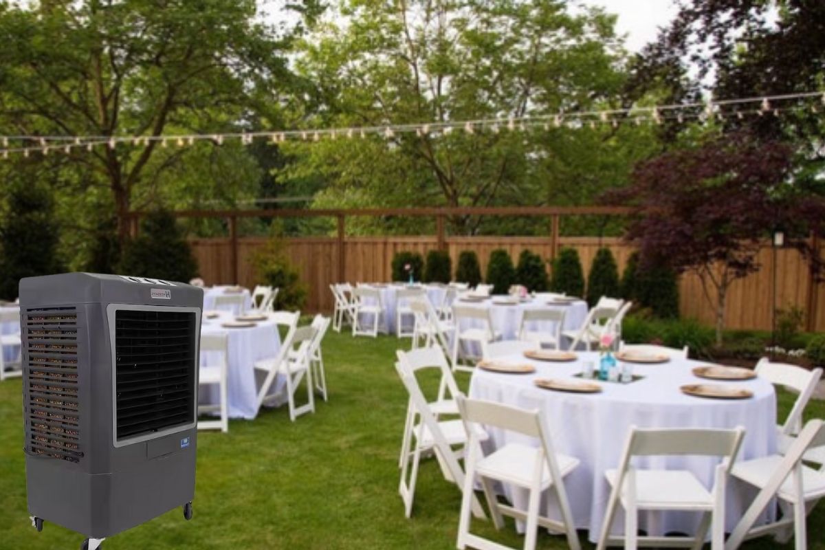 Elegant backyard event setup with round tables, white resin chairs, and evaporative cooler rental in Phoenix AZ for outdoor guest comfort.