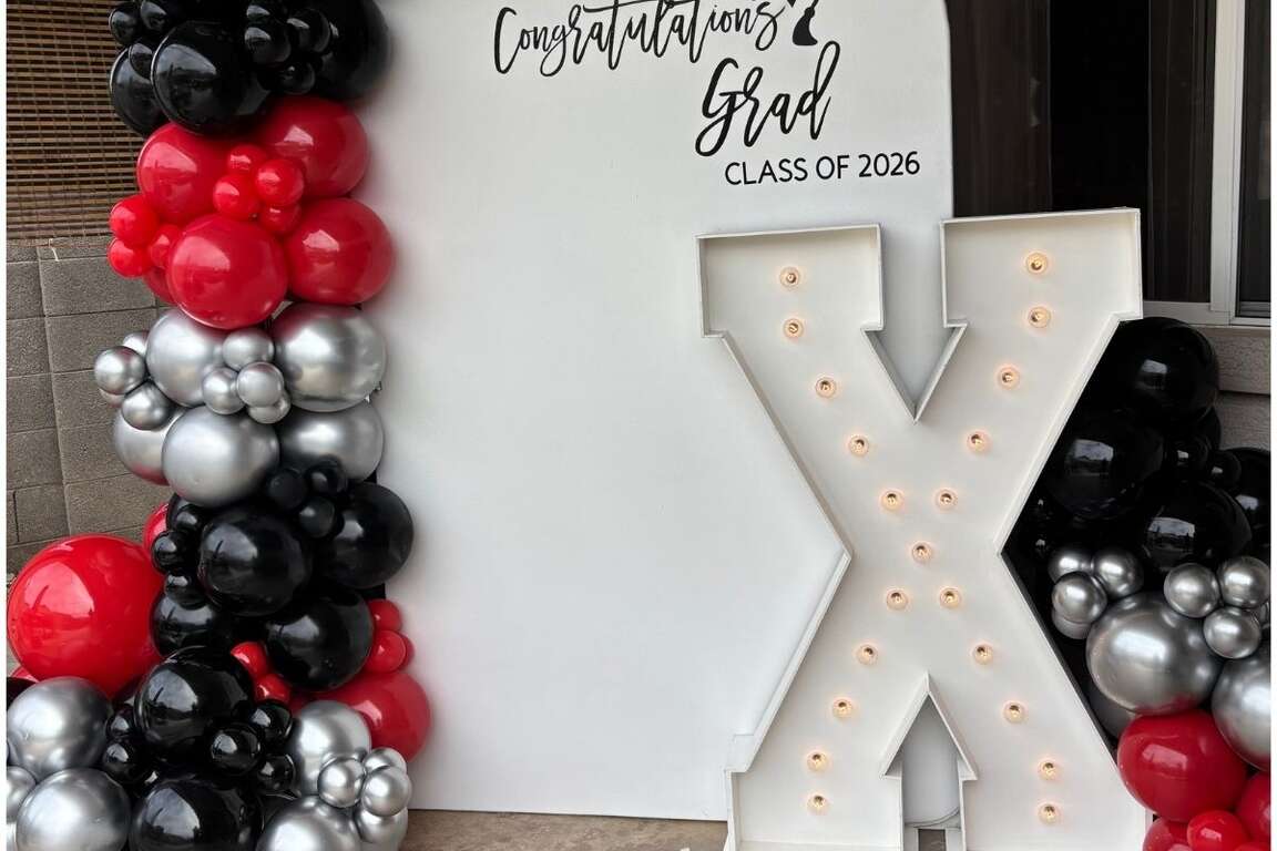 Graduation balloon garland and marquee letter setup in Avondale, AZ