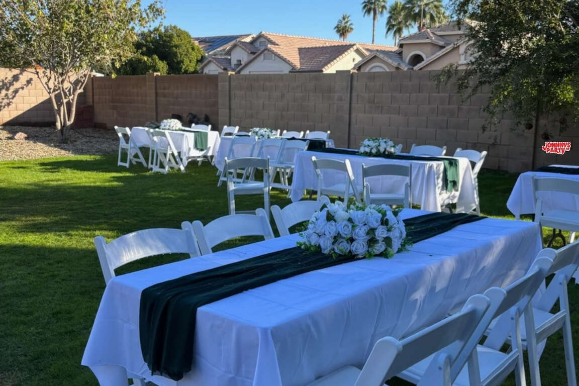 White folding chairs and tables set up in Phoenix, AZ