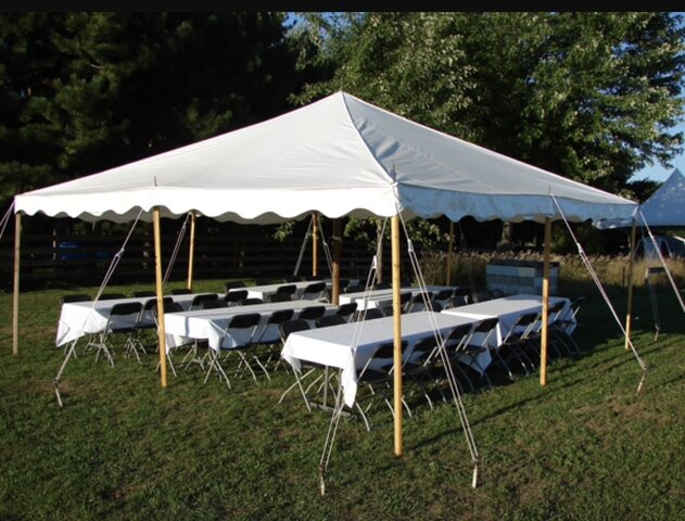 20x20 Pole tent  grass set up 4 tables and 35 chairs