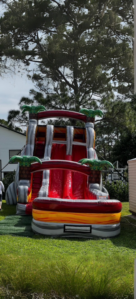 Jolly Times tropical red and yellow inflatable water slide. Jolly Times tropical red and yellow inflatable water slide.