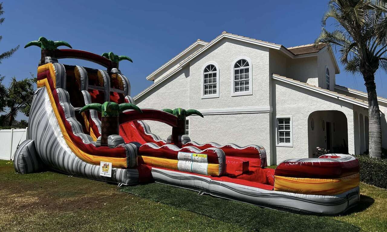 Backyard party water slide rental in Tequesta Florida by Jolly Times Backyard party water slide rental in Tequesta Florida by Jolly Times