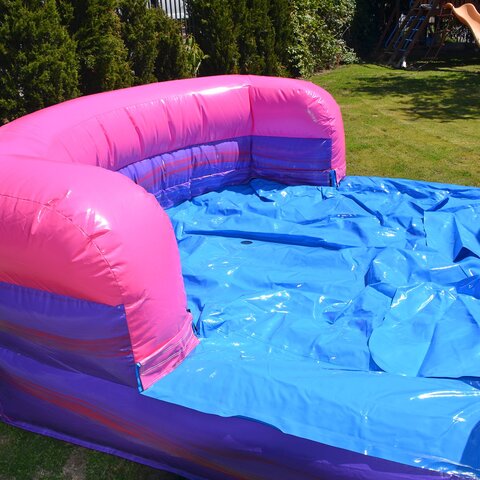 Purple water combo bounce house rental with hoop in Zebulon, NC