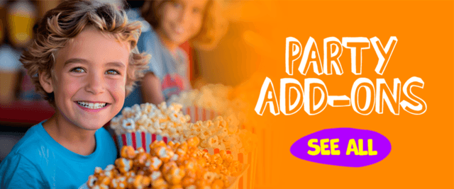 Happy boy holding a large box of fresh popcorn. Click to view all party add-ons and concession machine rentals from JT Jumpers and More.