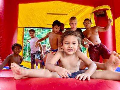 How to Host a Backyard Friendsgiving with a Bounce House Twist