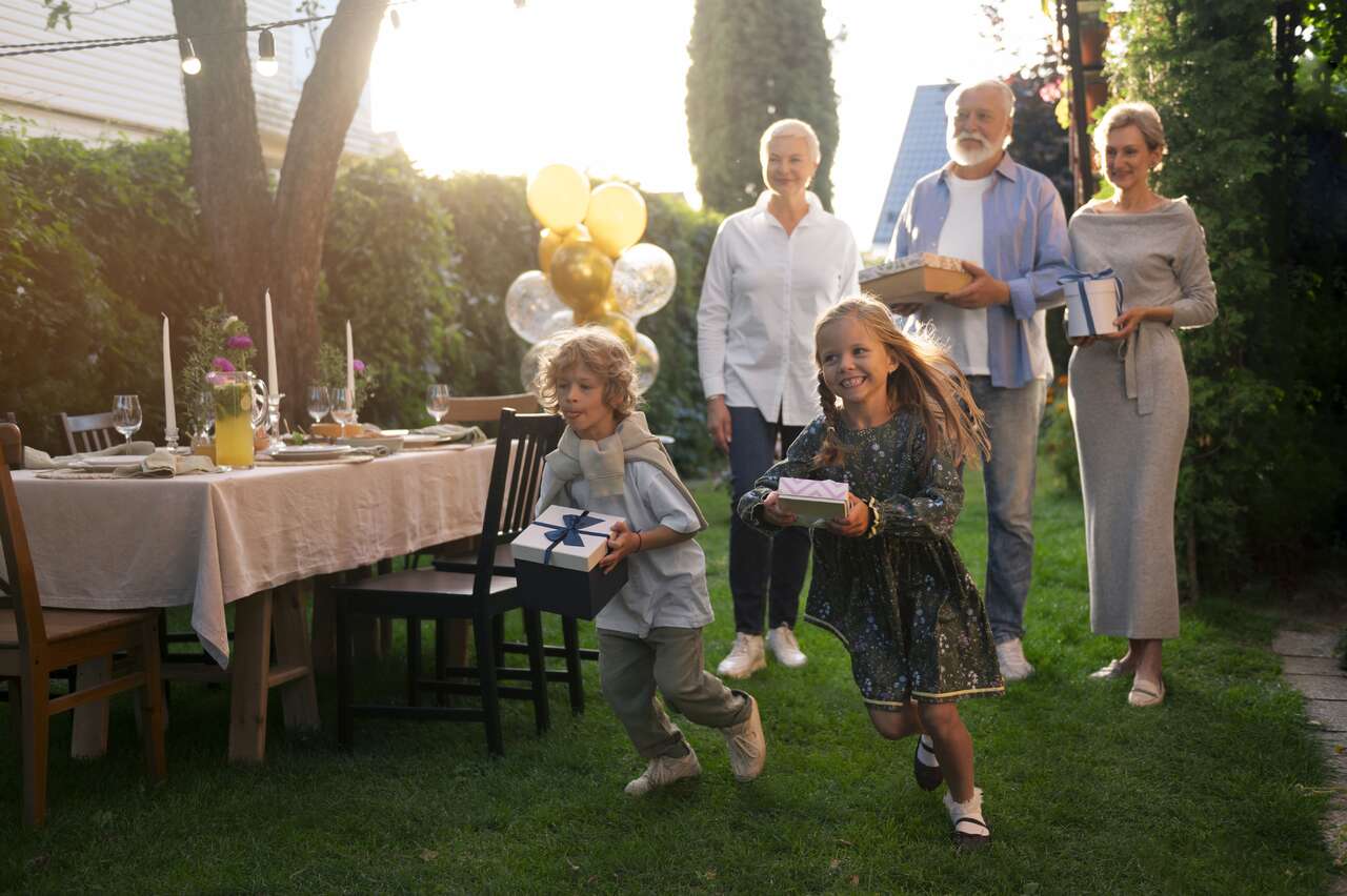 Family enjoying a backyard party with rentals from TUSKany Events Family enjoying a backyard party with rentals from TUSKany Events