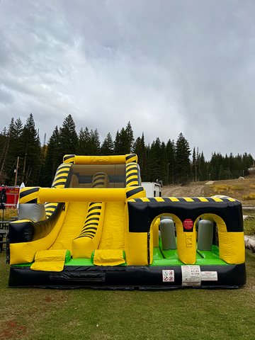 An inflatable obstacle course rental in Salt Lake City set up for a Childs birthday party