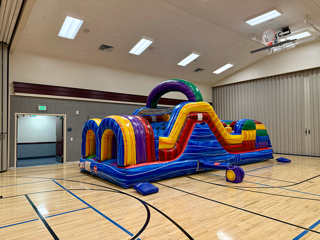 30ft colorful inflatable obstacle course rental in Utah for parties school events and backyard fun