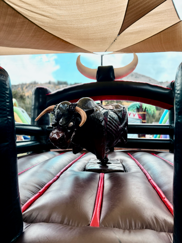 up close image of mechanical bull with mean look on its face