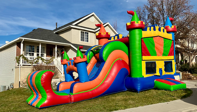 Colorful XL combo bounce house and water slide with pool rental in Utah for parties and summer events