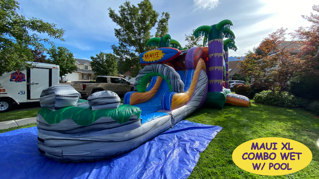 Maui tropical themed inflatable bounce house set up on front yard of Childs birthday party