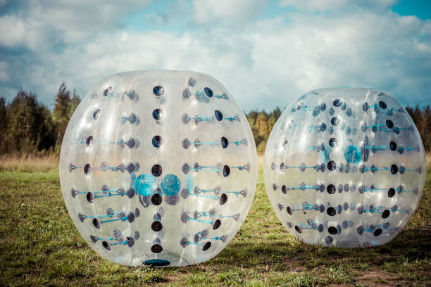 empty inflated bumper balls in a field