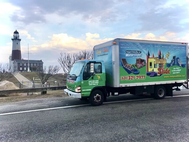 Jump & Slide branded delivery truck parked at Montauk Lighthouse, Long Island