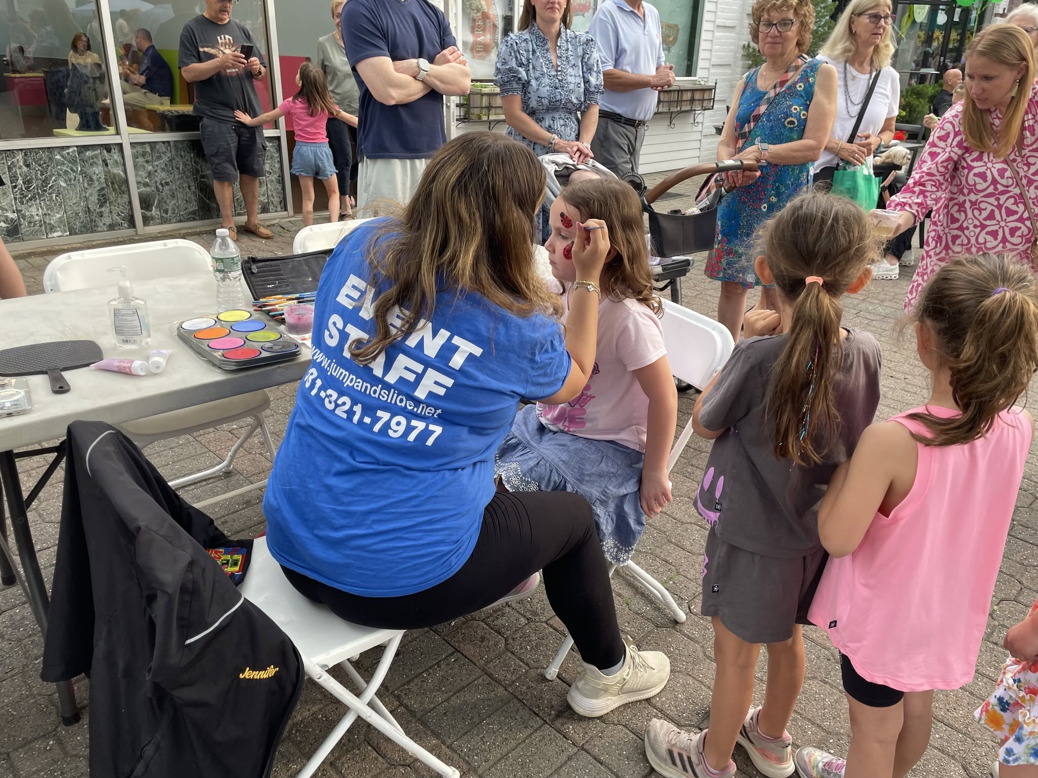 Jump and Slide face painting at a Long Island street fair