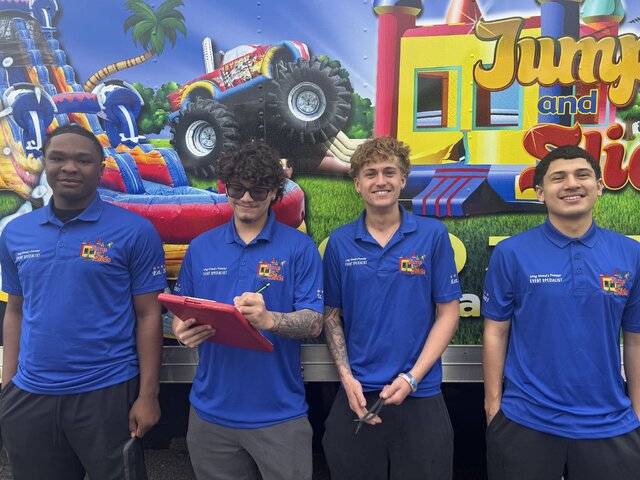 The Jump and Slide Entertainment delivery crew with a company truck, Deer Park NY