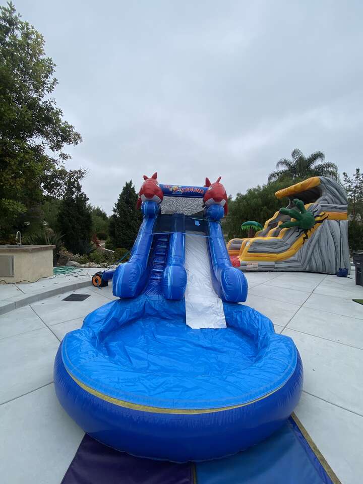 Setting up for Kids to enjoying a water slides rental in Brea