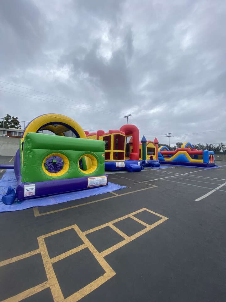 students enjoying inflatables at a Buena Park school event