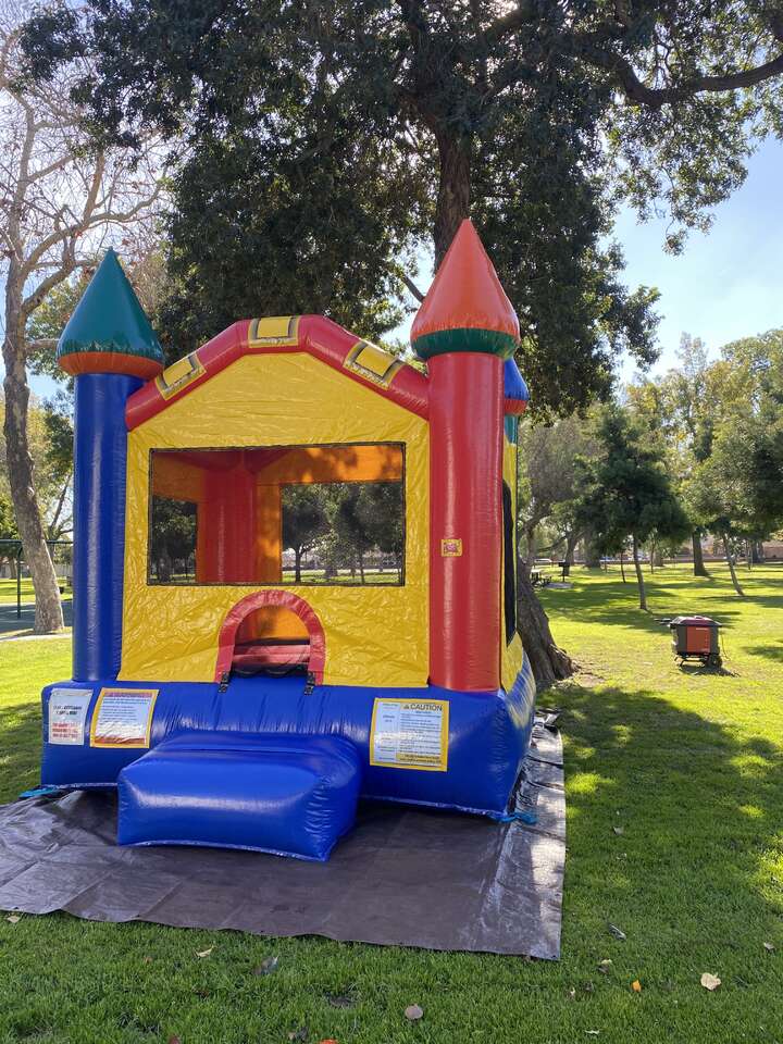 castle bounce house rental set up at a park in Anaheim CA