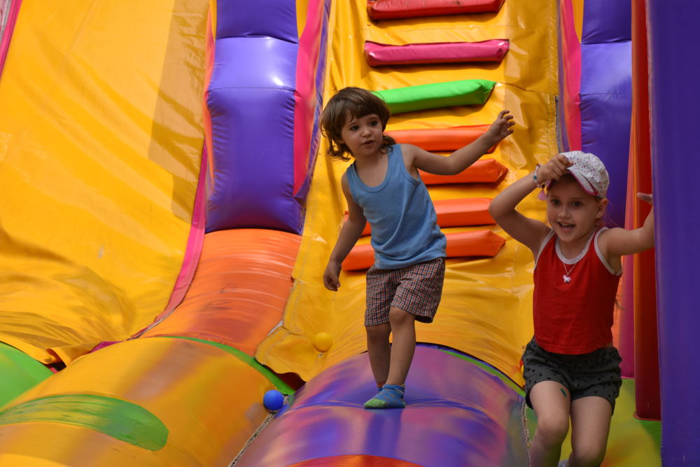 Kids playing on inflatable slide