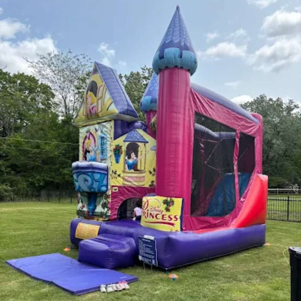 Keystone Bounce Princess Combo Dry Only bounce house with slide set up for an outdoor event