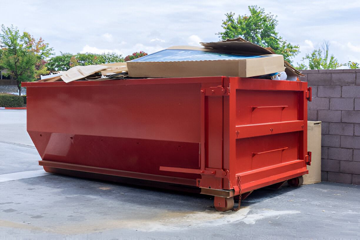 Krug Disposal & Hauling dumpster in commercial site