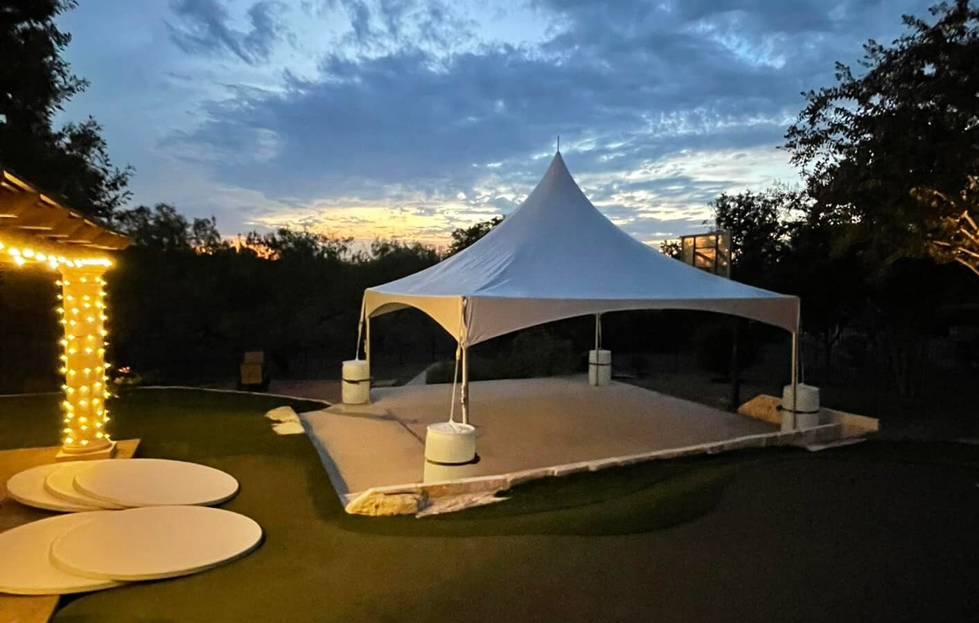 Elegant party tent set up by Exclusive Event Rentals for an outdoor event Elegant party tent set up by Exclusive Event Rentals for an outdoor event