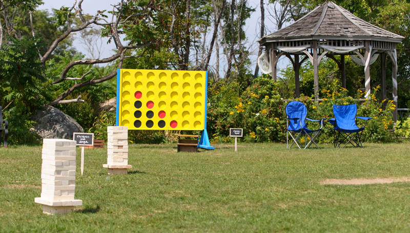 Giant yard games including Jenga and Connect 4 set up for outdoor fun by Exclusive Event Rentals Giant yard games including Jenga and Connect 4 set up for outdoor fun by Exclusive Event Rentals