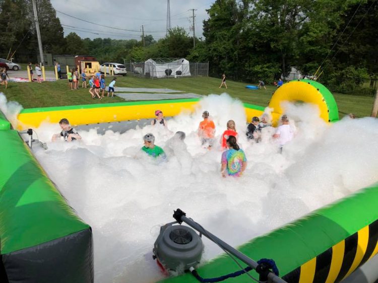 Kids enjoying a fun and safe foam party setup
