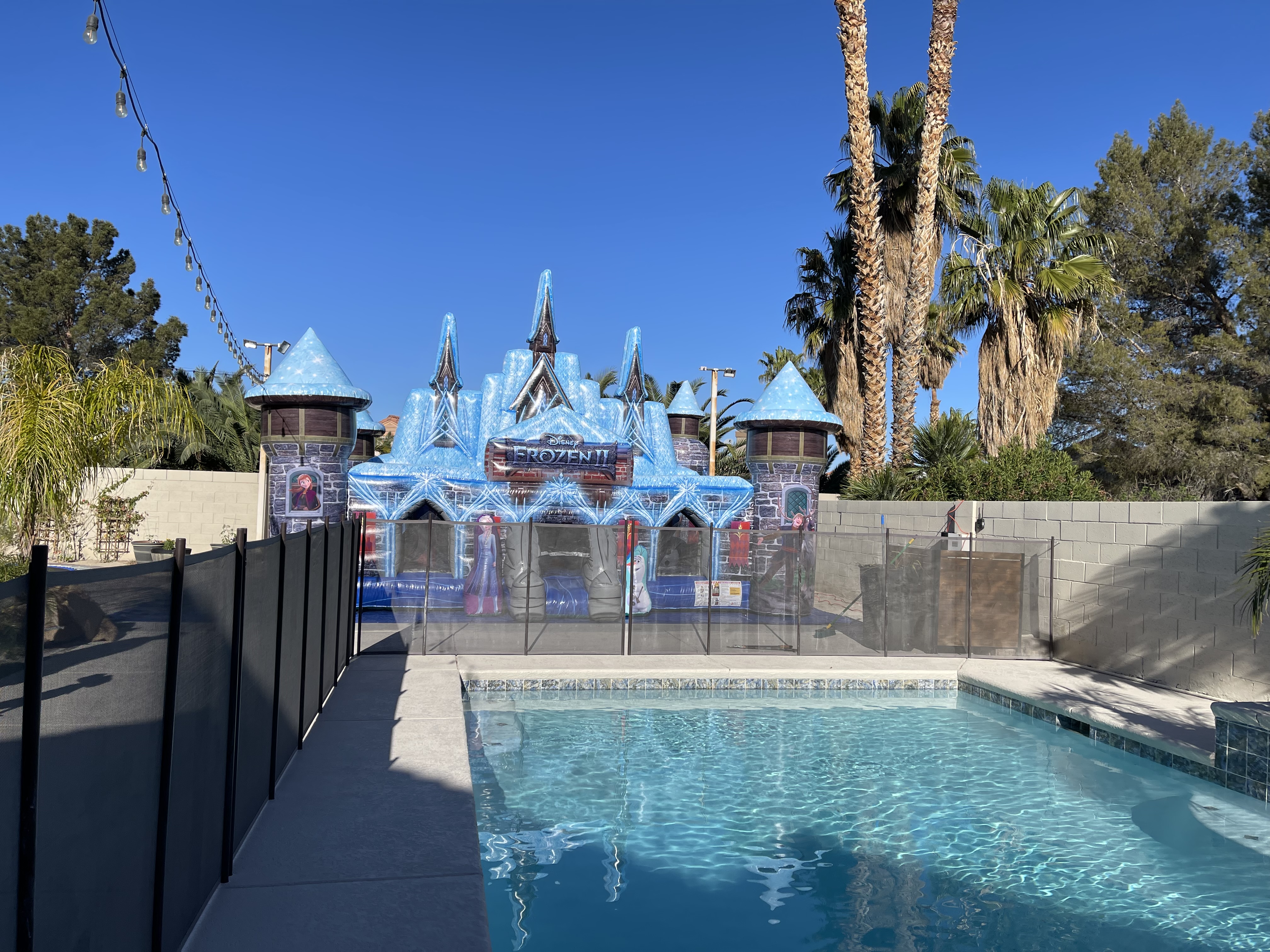 Frozen 2 themed bounce house playground featuring vibrant colors, whimsical designs, and inflatable structures, designed for children's imaginative play and adventure
