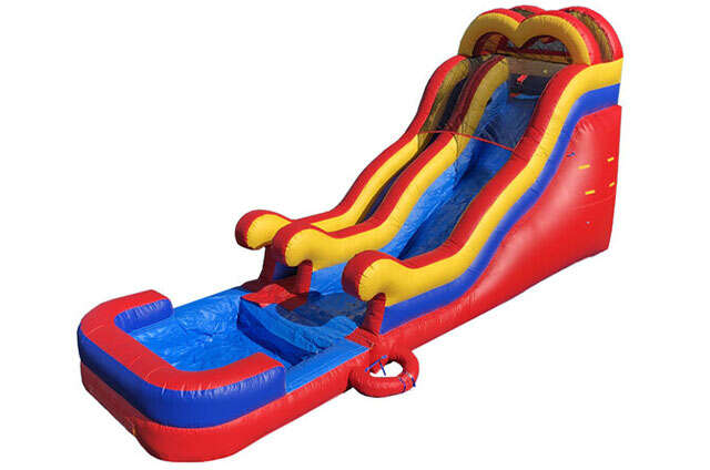 Dual-lane red, yellow, and blue inflatable water slide with splash pool