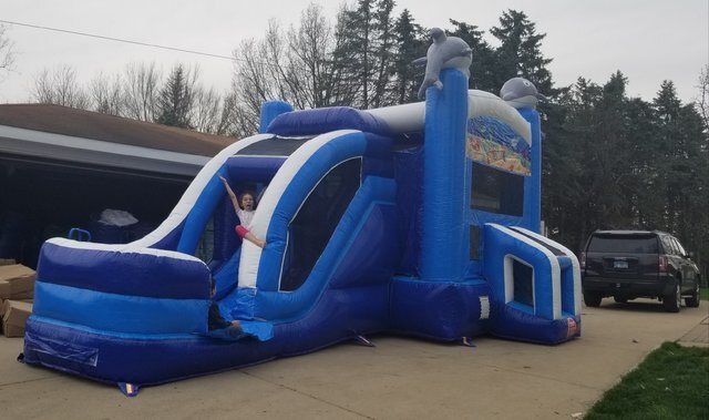 Dolphin Combo Wet n Dry jump House rentals in Naperville offer various bounce house and water slide rentals, including Moon Jumps and Moonwalks. They are the best inflatable house rentals