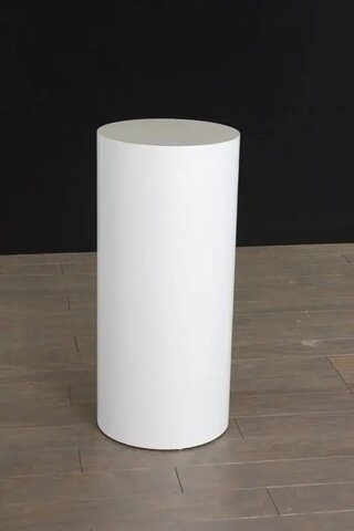 White cylinder stand