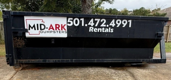Roll-off construction debris box rental with a Mid-Ark Dumpsters LLC container on-site
