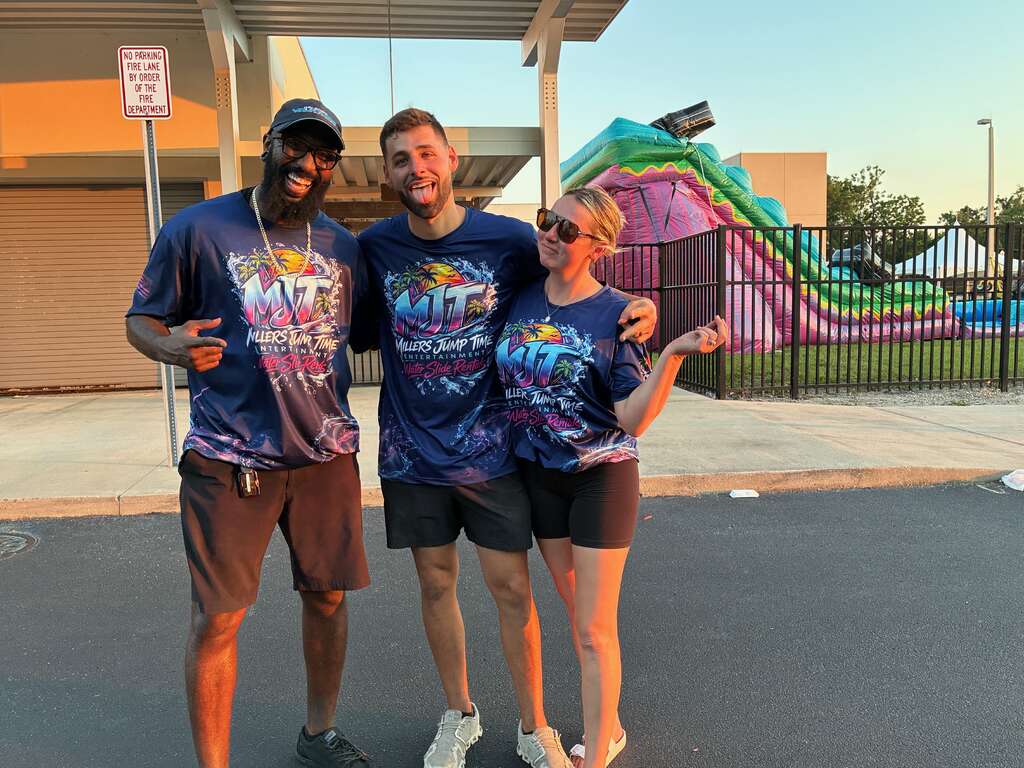 Millers Jump Time team members smiling together after a professional event setup