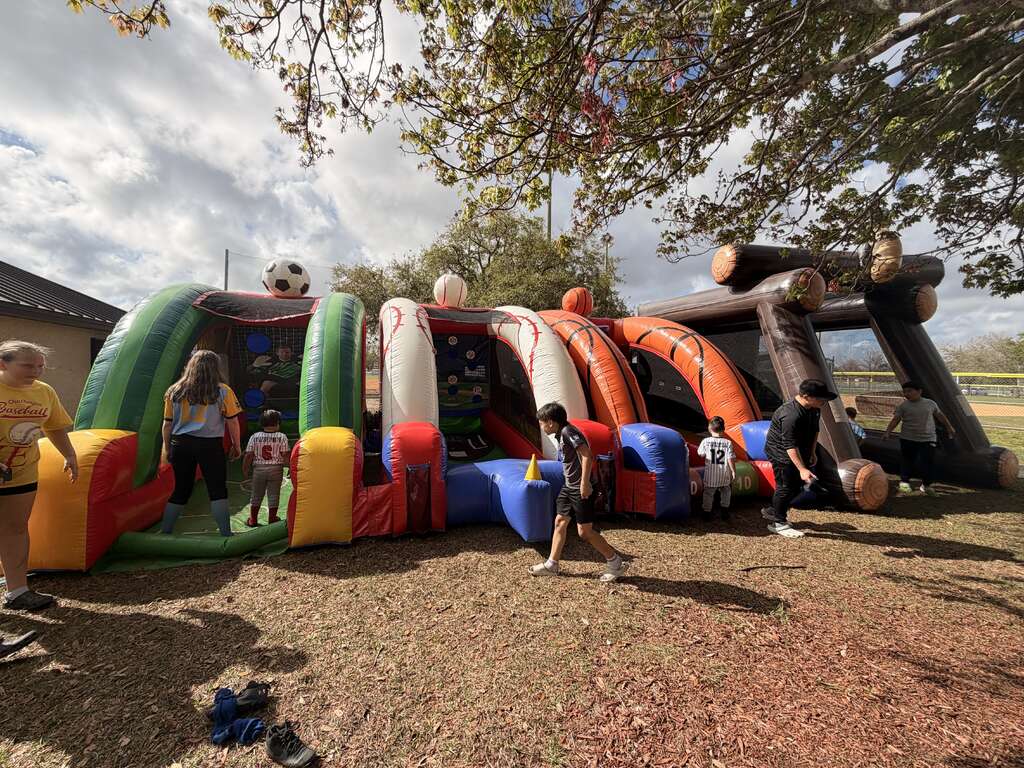 Sports-themed inflatable games at a Central Florida school and community event by Millers Jump Time Entertainment