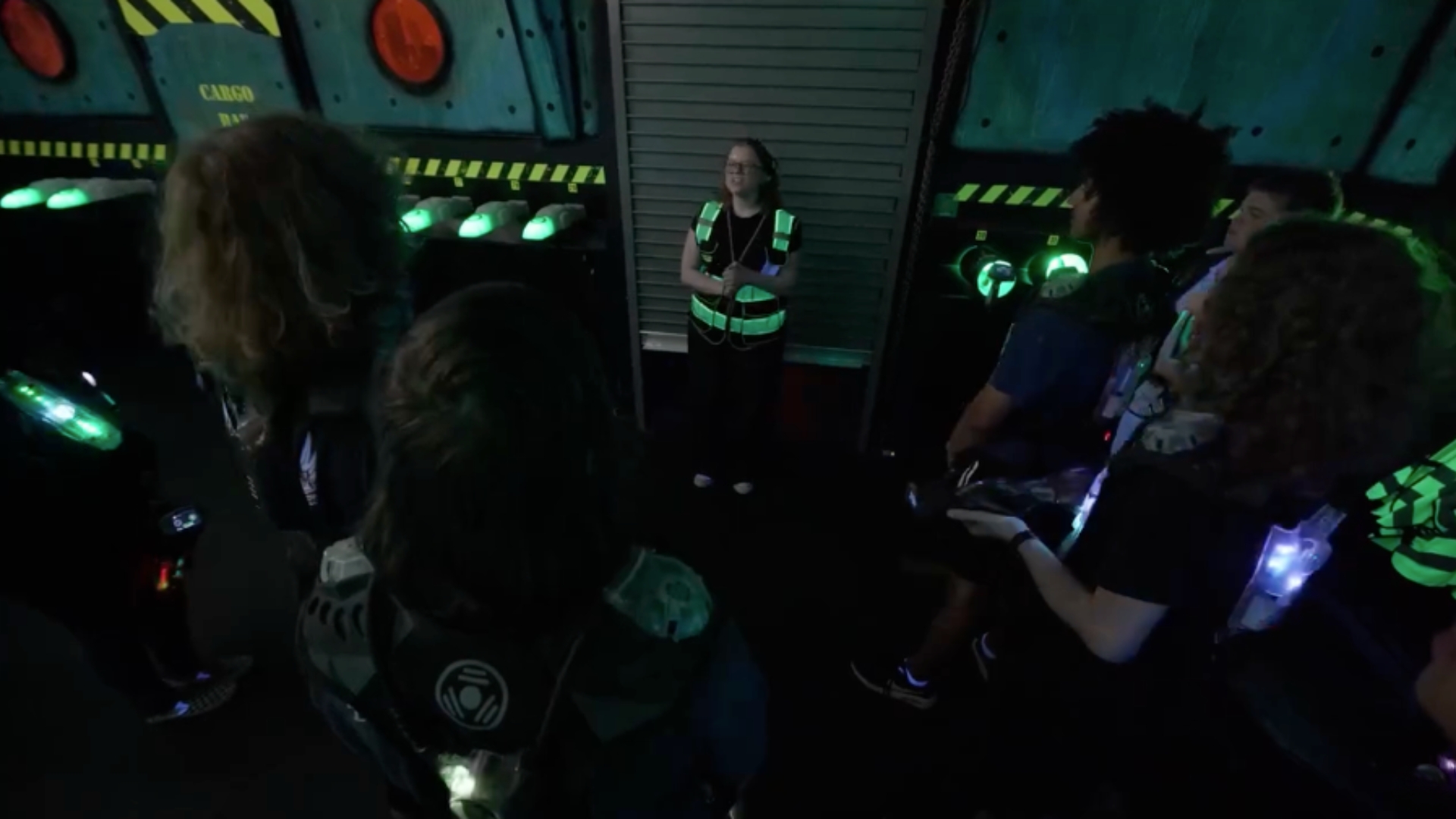 Players watching the pre-game hologram briefing — Mission Laser 757 Chesapeake, VA