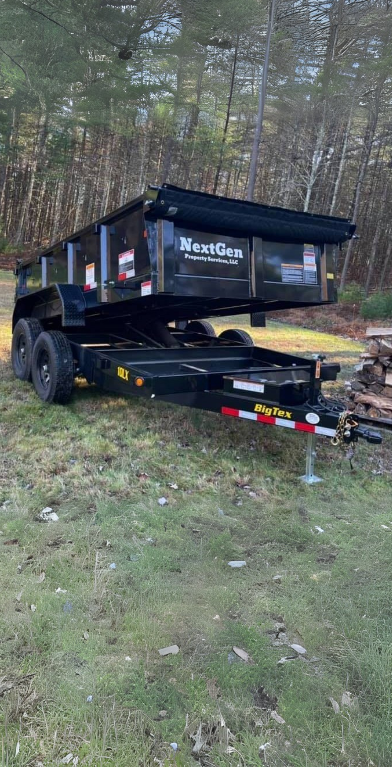 NextGen Property Services black dump trailer on grassy field
NextGen Property Services black dump trailer on grassy field
