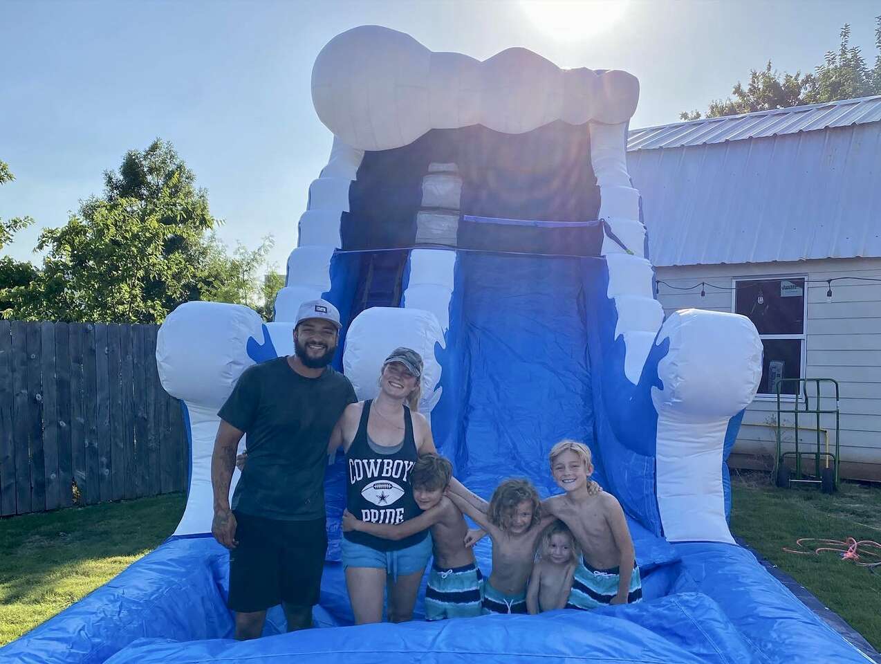 Family enjoying a water slide rental from Party Time Rentals in New Jersey Family enjoying a water slide rental from Party Time Rentals in New Jersey