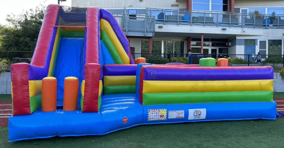 Backyard inflatable obstacle course to rent from North Bay Jump